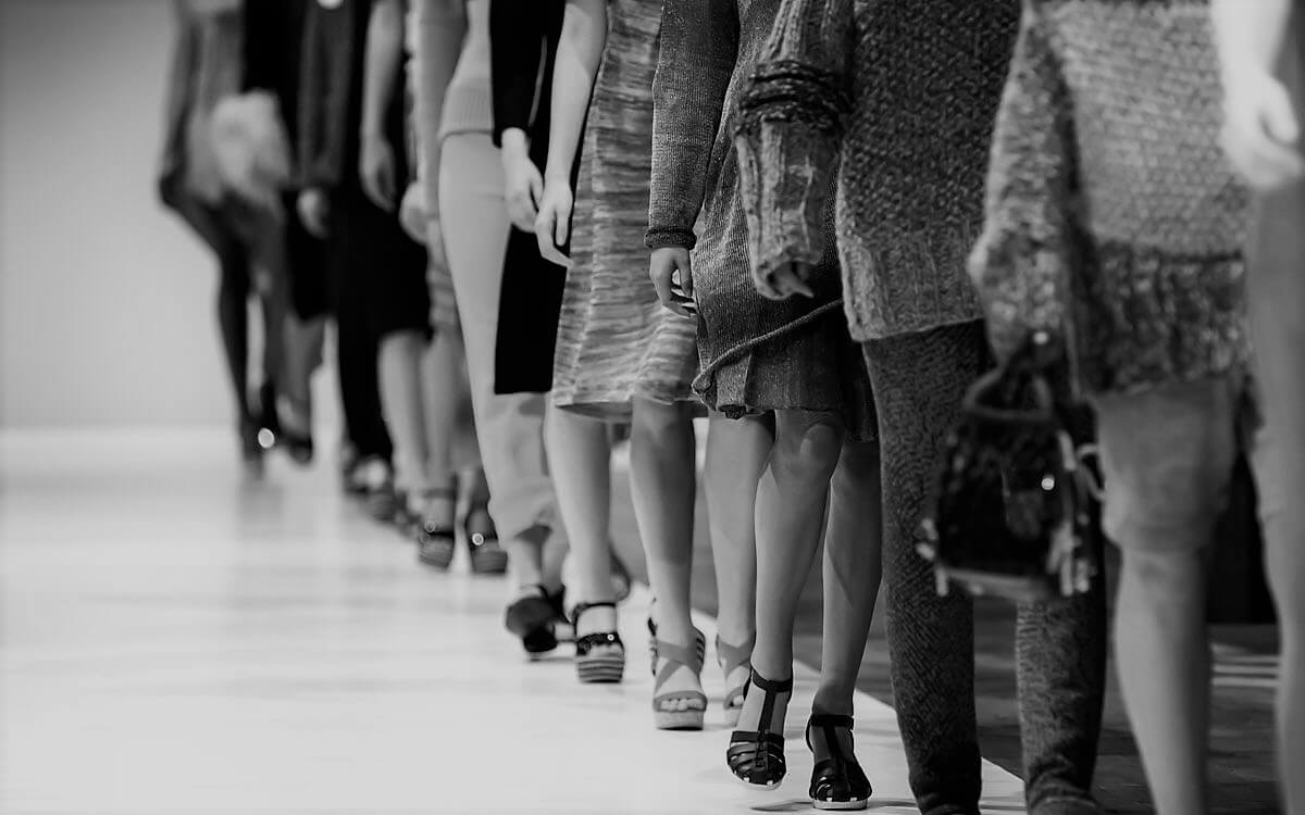 Fashion models lined up showcasing regulation best interest.