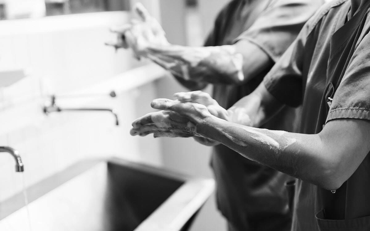 Medical staff washing their hands, preventing infection