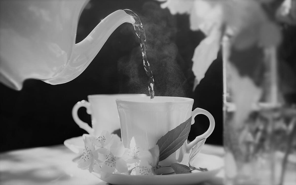 Person pouring Tea into a Cup