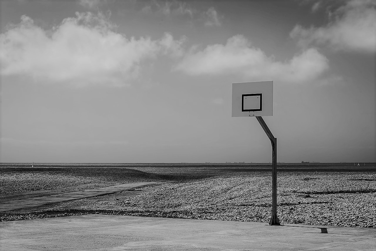 A Basketball court with desert background