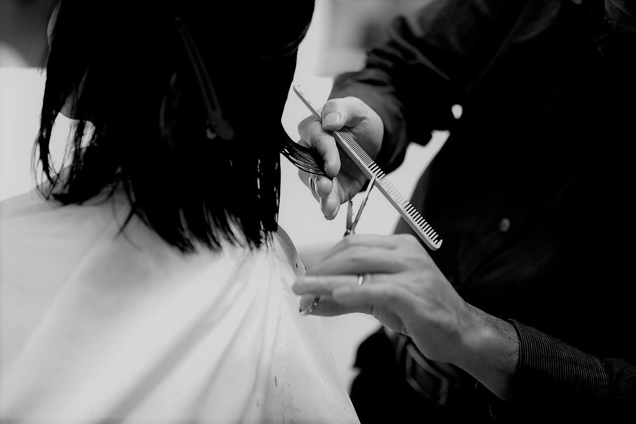 Barber styling hair on JetBlue Airways flight