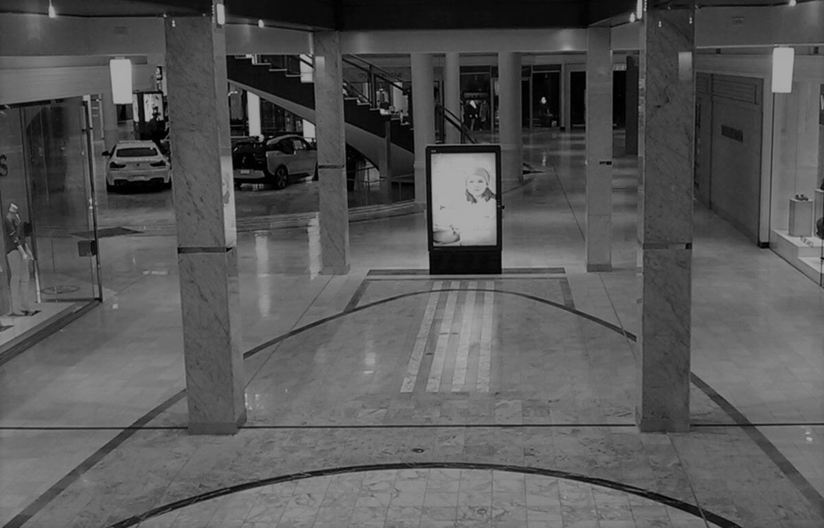 Empty mall interior owned by Duke Realty in black and white