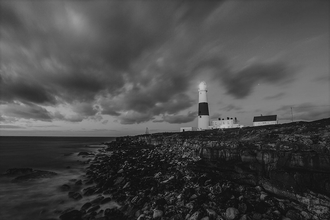 Ocean Lighthouse Wide Shot with Cloudy Background