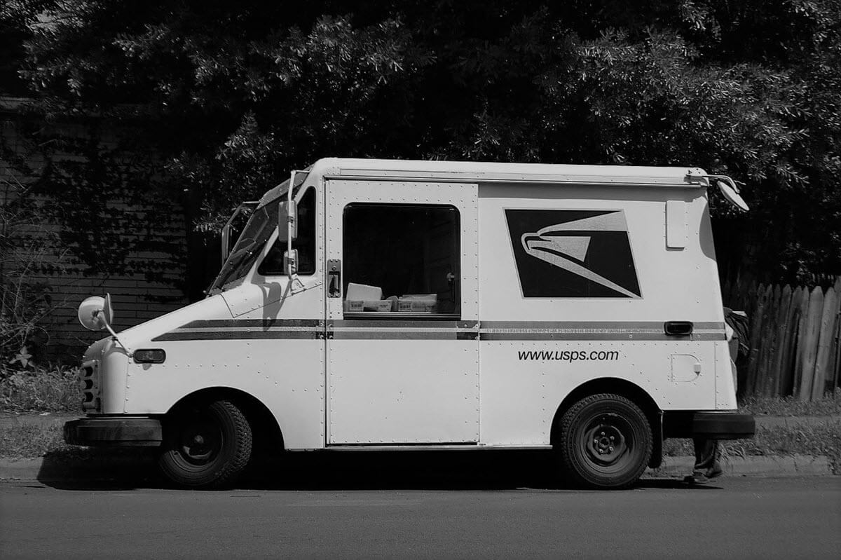 White truck delivering mail
