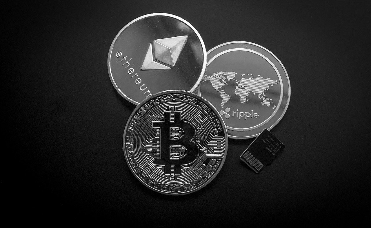 Cryptocurrency ETF with three coins representing ethereum, bitcoin and more