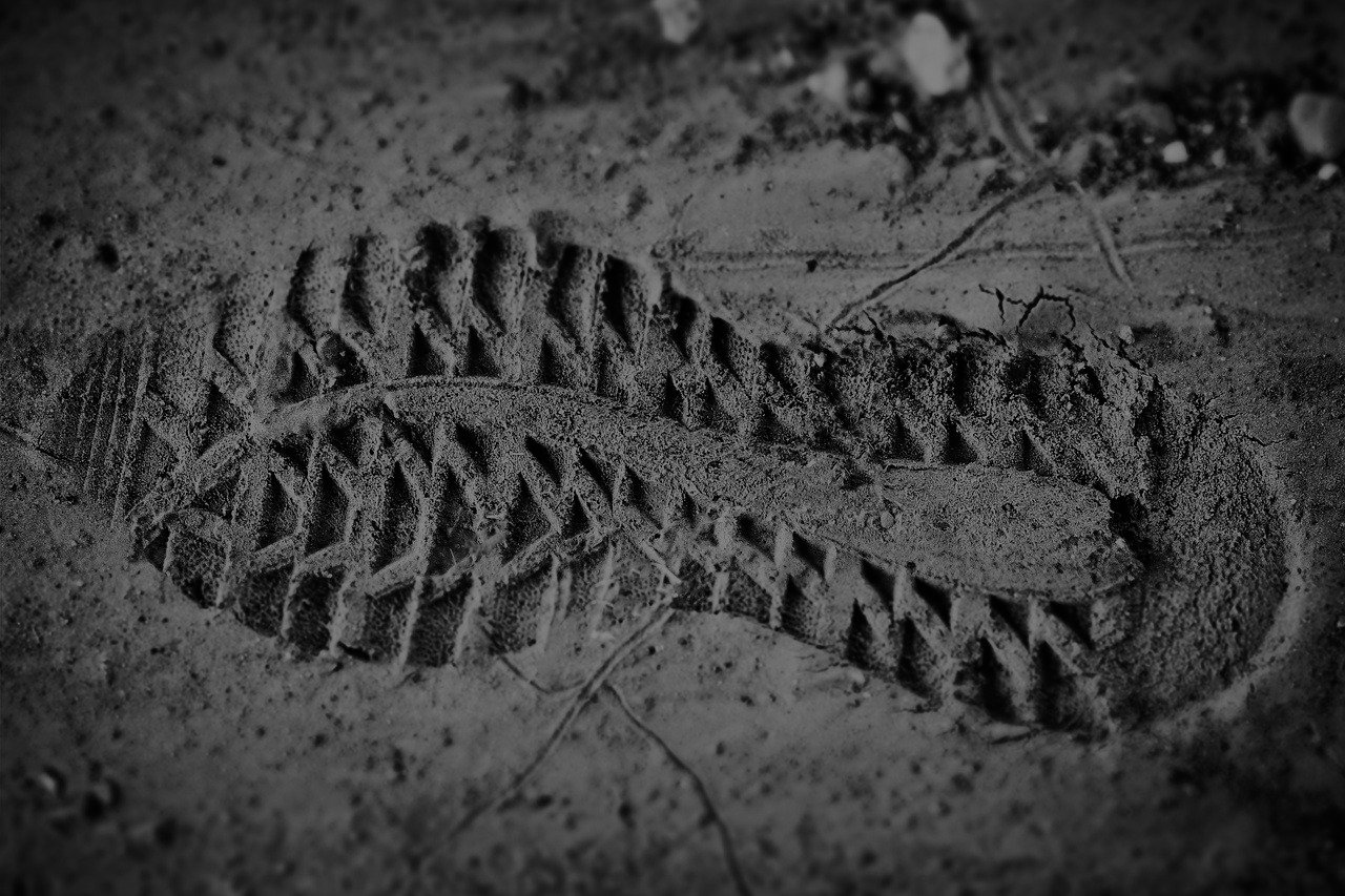 Footprint in mud with deep tread