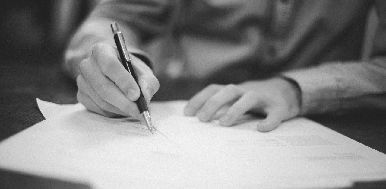 Man writing on a paper