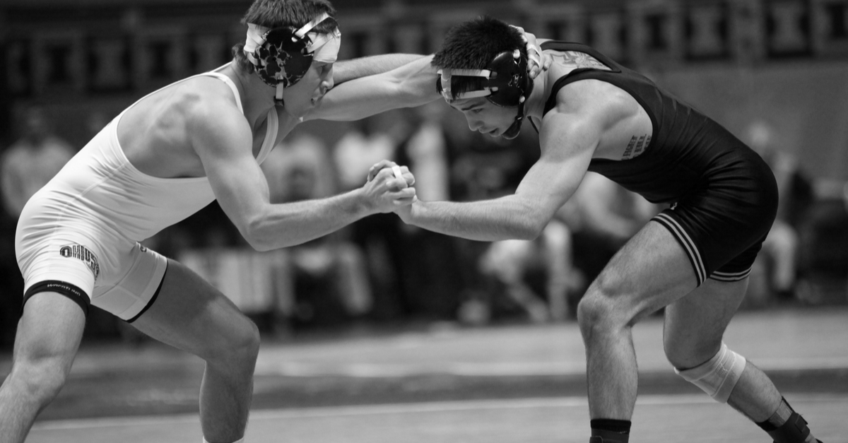 Men Wrestling at a Match like Board of Directors Fighting