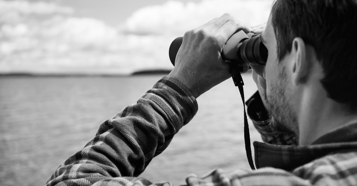 Vaccine seeker scanning horizon with binoculars