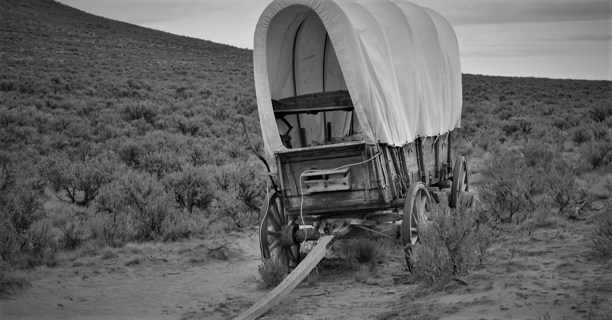 Abandoned cloth-covered pioneer wagon, deserted like BlockFi