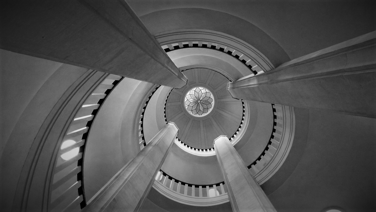 Spiral staircase, down looking up with pillars