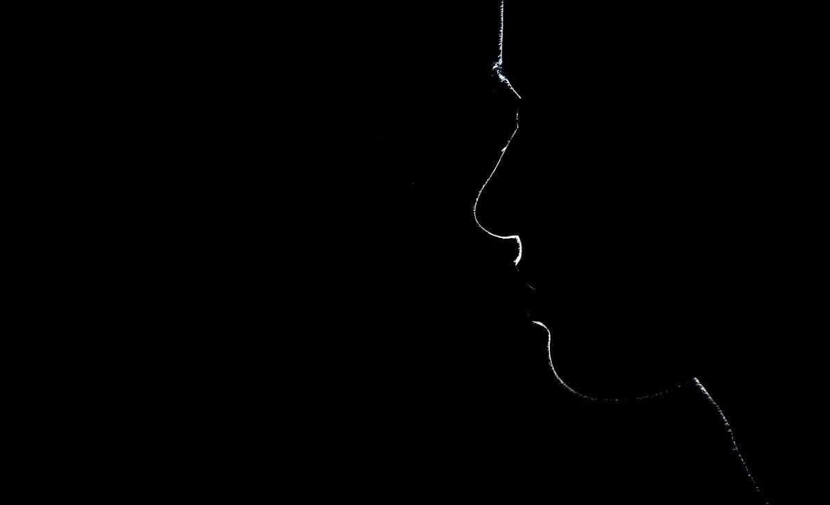 Silhouette of a woman's face in Supreme Court.