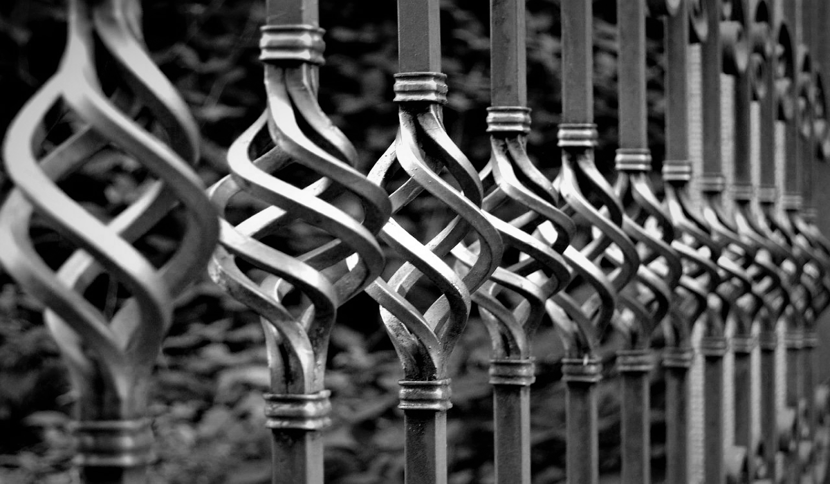 Spiral iron gate railings meeting SOX compliance.