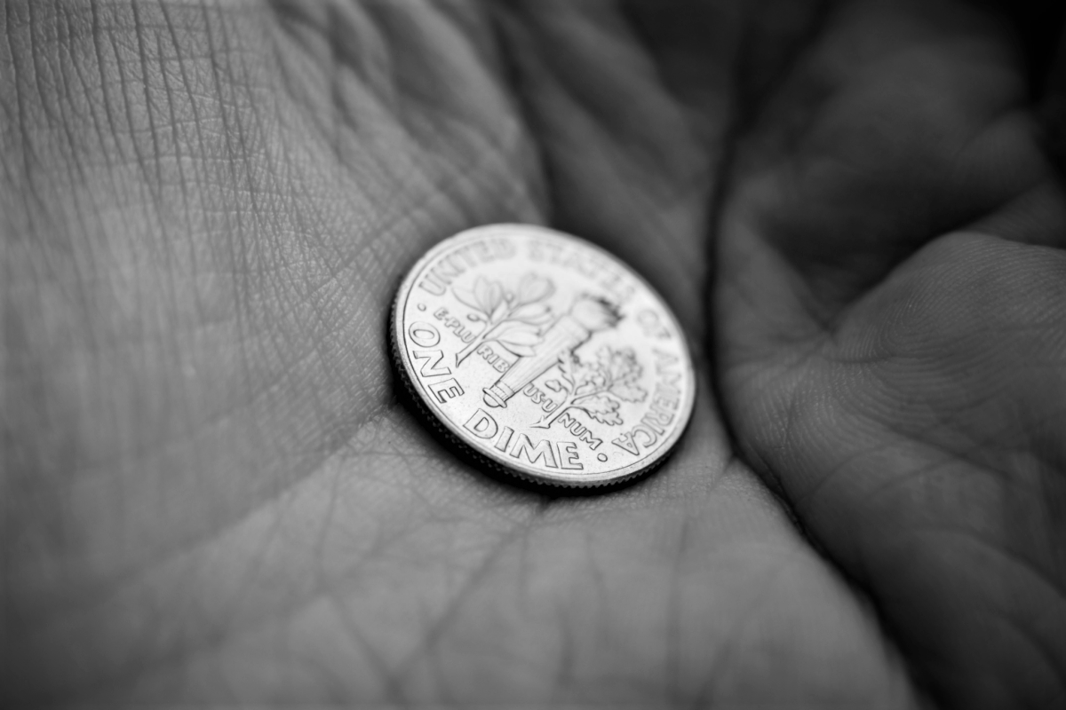 Monochrome dime on palm