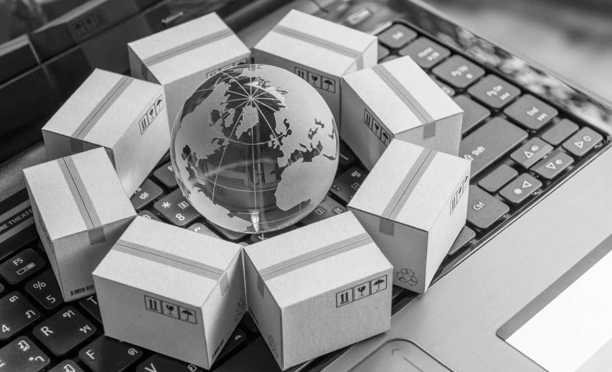 Globe surrounded by packages, representing the global workforce in business
