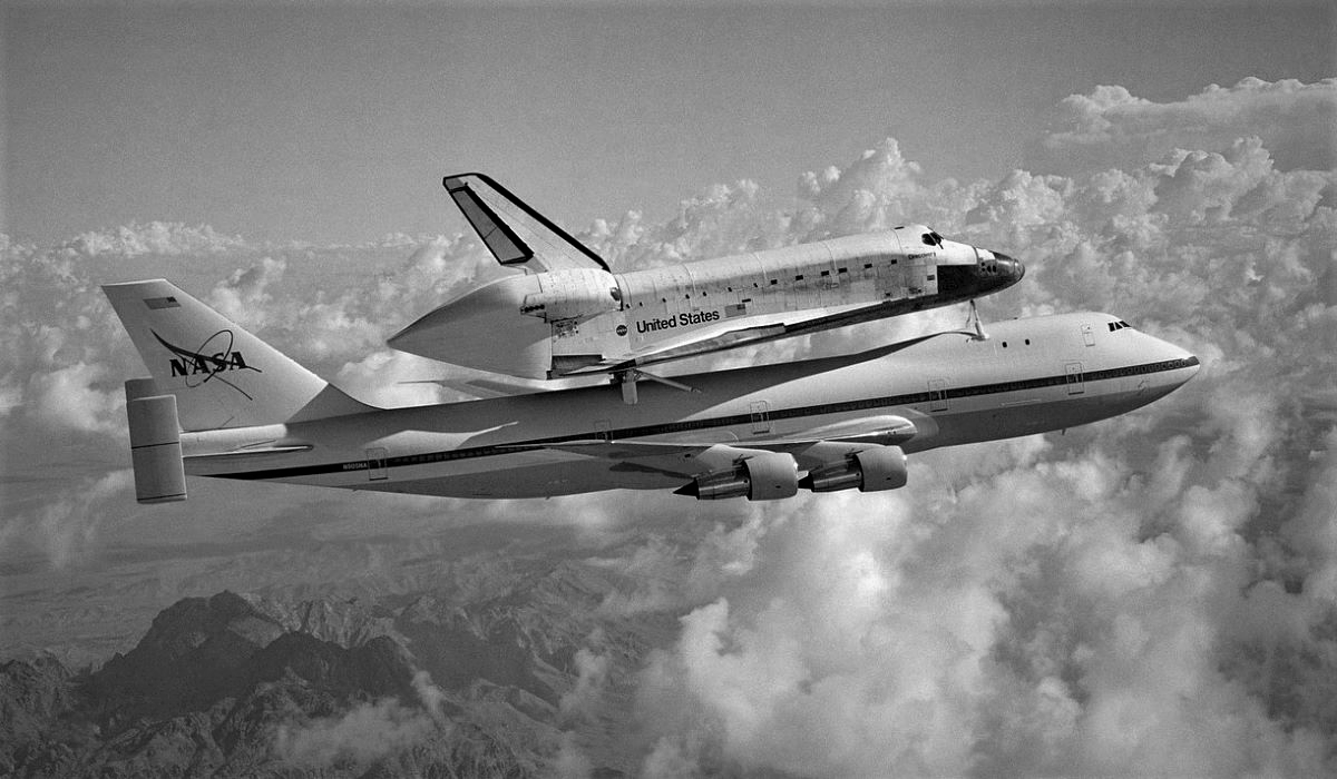 A shuttle carrier aircraft flying with space shuttle on its back