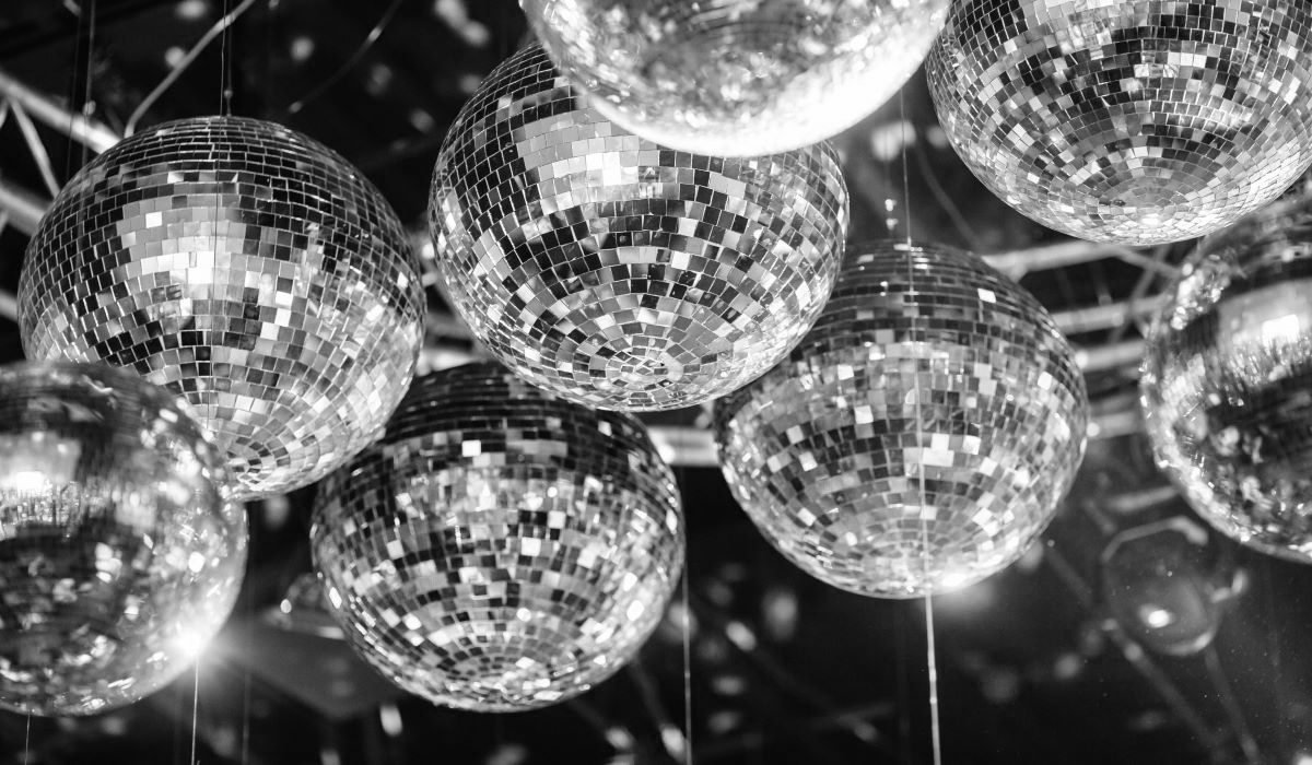 Reflective disco balls hanging from a ceiling