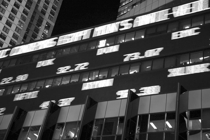 blurred digital ticker display in NYC