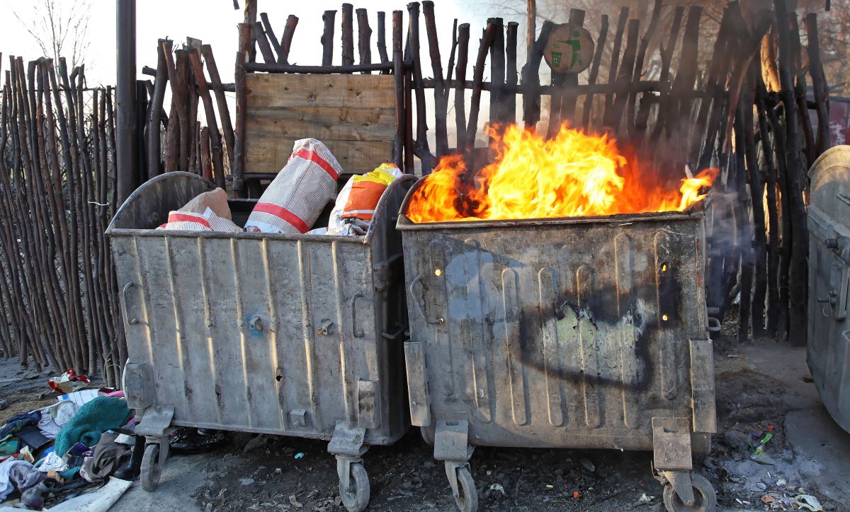 A dumpster fire representing bank engulfed in flames