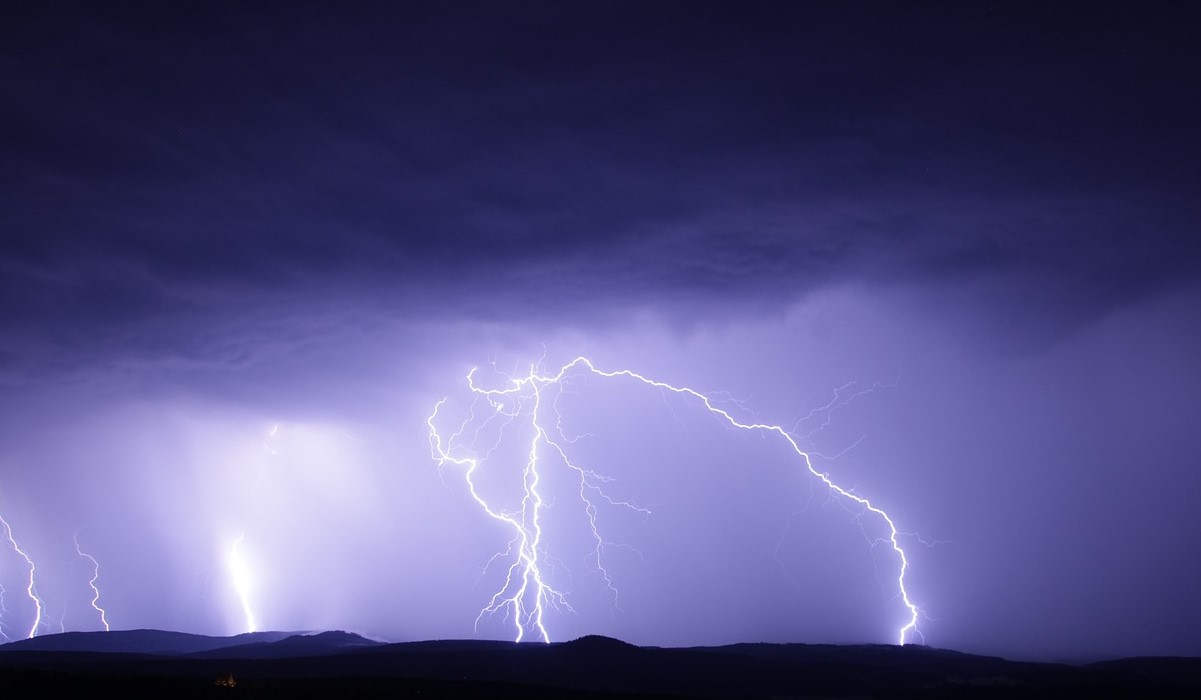 Lightning flashes in the night sky