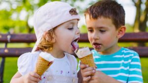 Kids sloppily eating ice cream