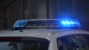 Blue patrol light on top of police car