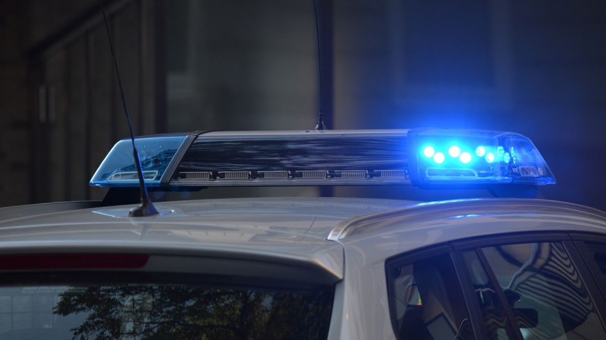 Blue patrol light on top of police car