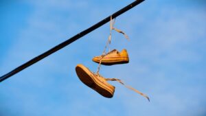 Shoes hanging from a wire