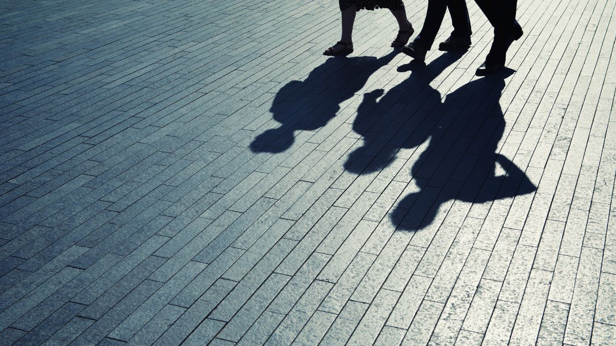 Shadows of people cast on the ground