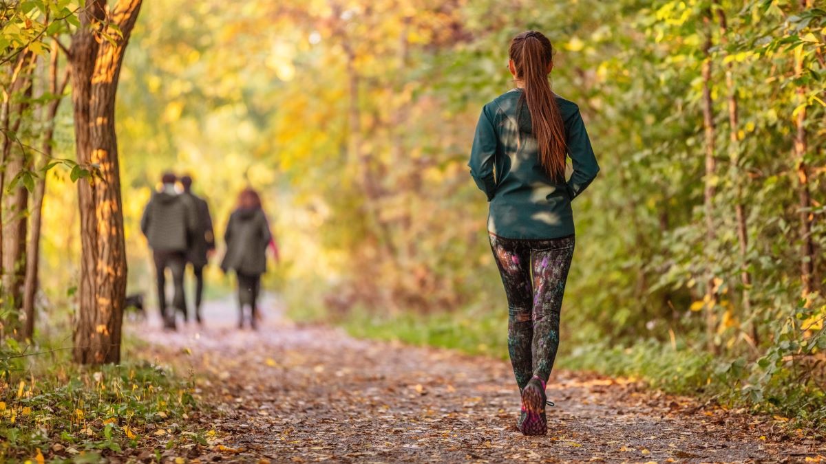 woman walking on a trail