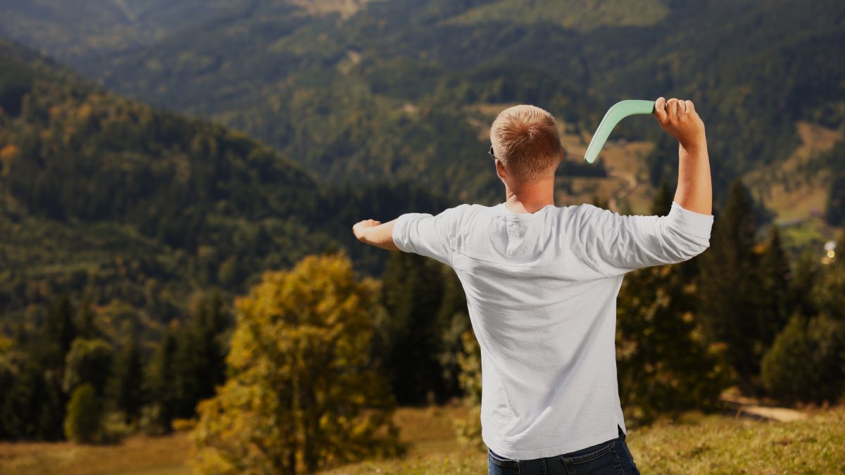 man throwing boomerang