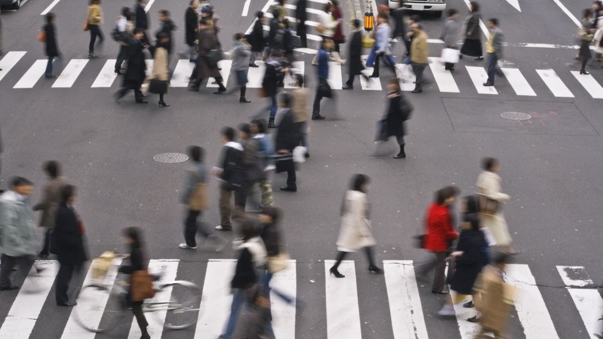 hustling commuters in crosswalk