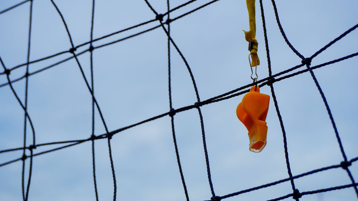 whistle hanging from a goal net
