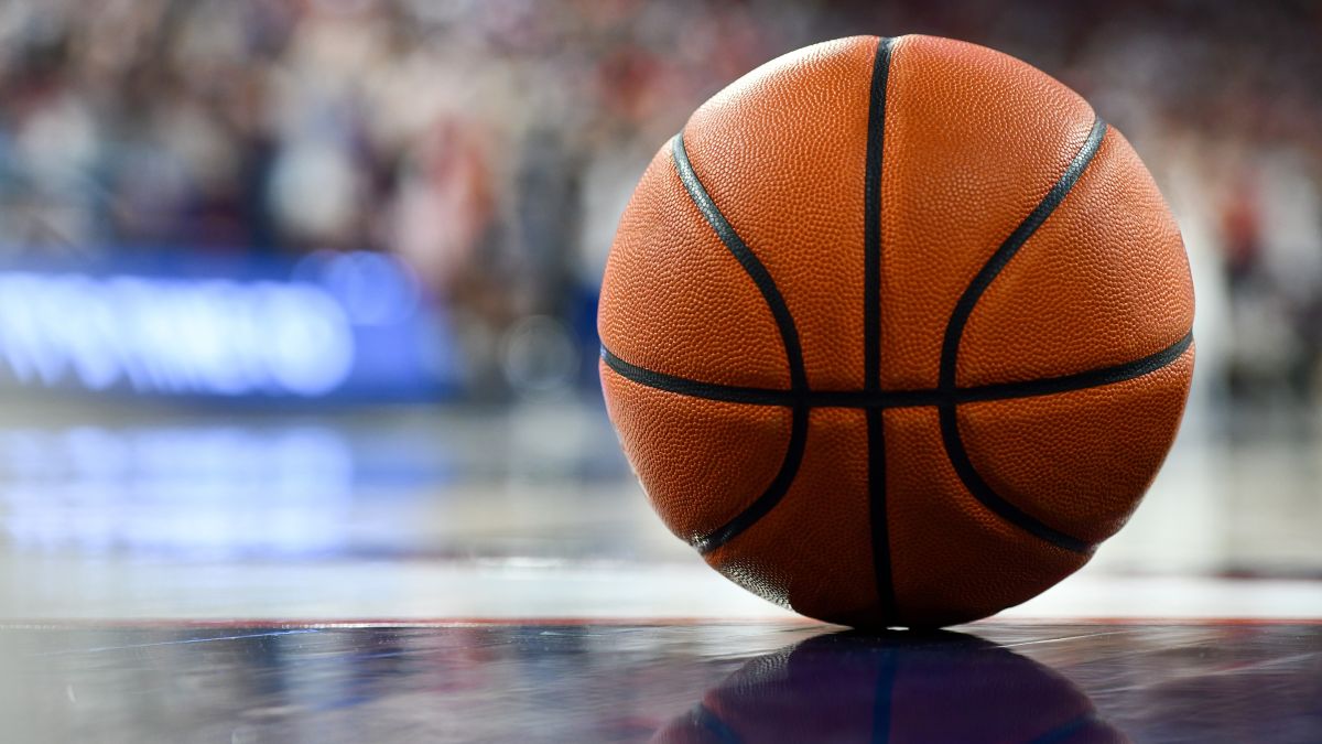 Basketball sitting on the floor of a court