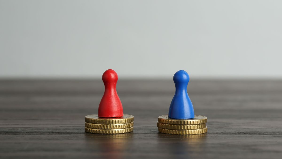 red and blue pegs each sitting atop equal piles of coins